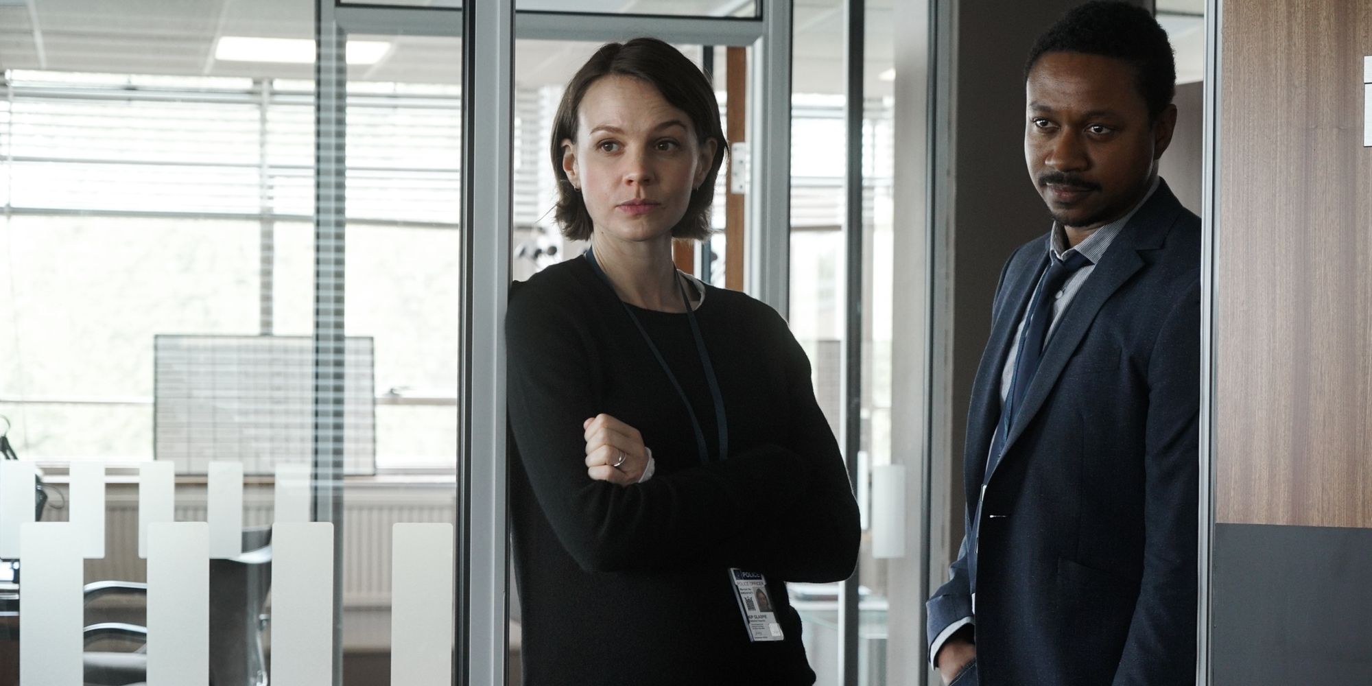 Carey Mulligan and Nathaniel Martello-White in a doorway in Collateral on Netflix