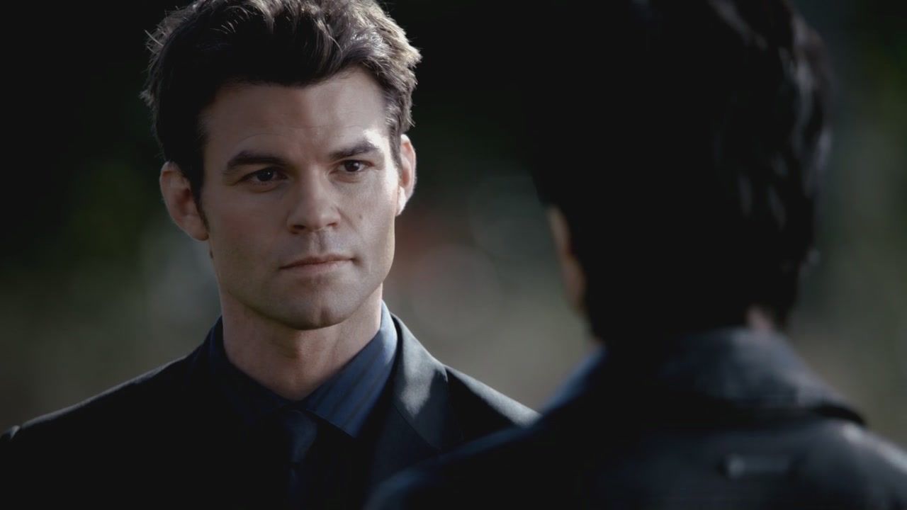 Elijah in The Vampire Diaries looks at someone off camera.