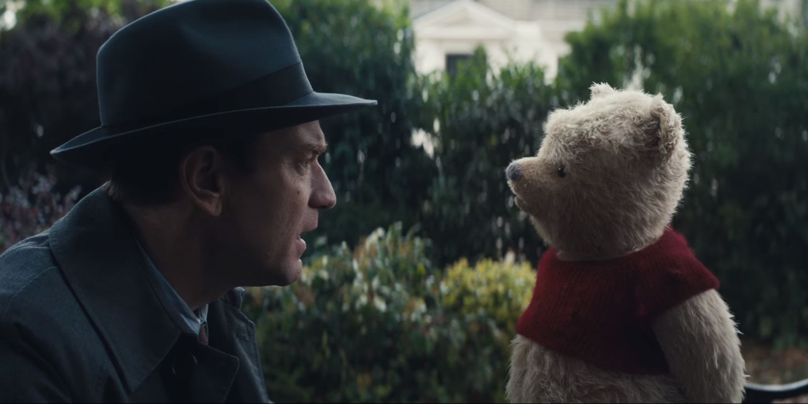 Pooh looking at Christopher Robin in Christopher Robin