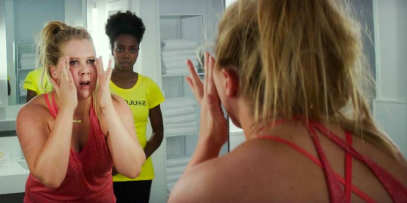 Amy Schumer looks in a mirror in I Feel Pretty