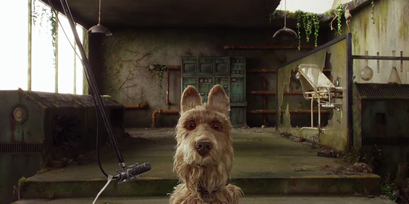 Rex sits near a microphone in Isle of Dogs