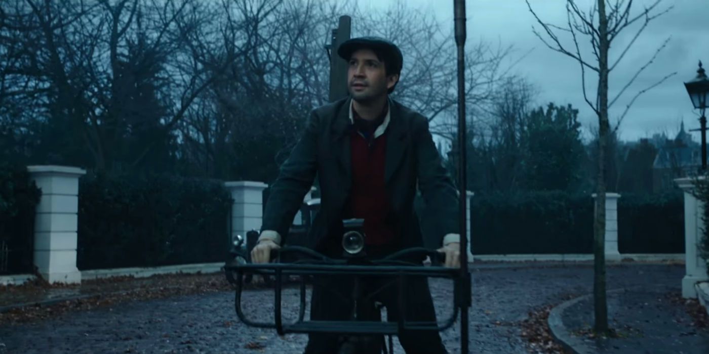 Jack rides his bike in the early morning light in Mary Poppins Returns