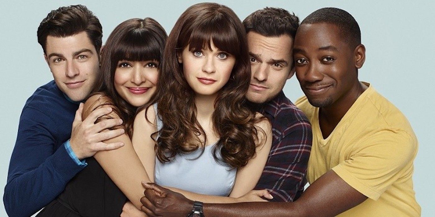 The New Girl cast in character with their arms around Zooey Deschannel as Jess in a promotional image