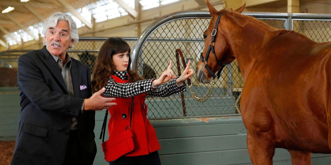 Zooey Deschanel playing with a horse