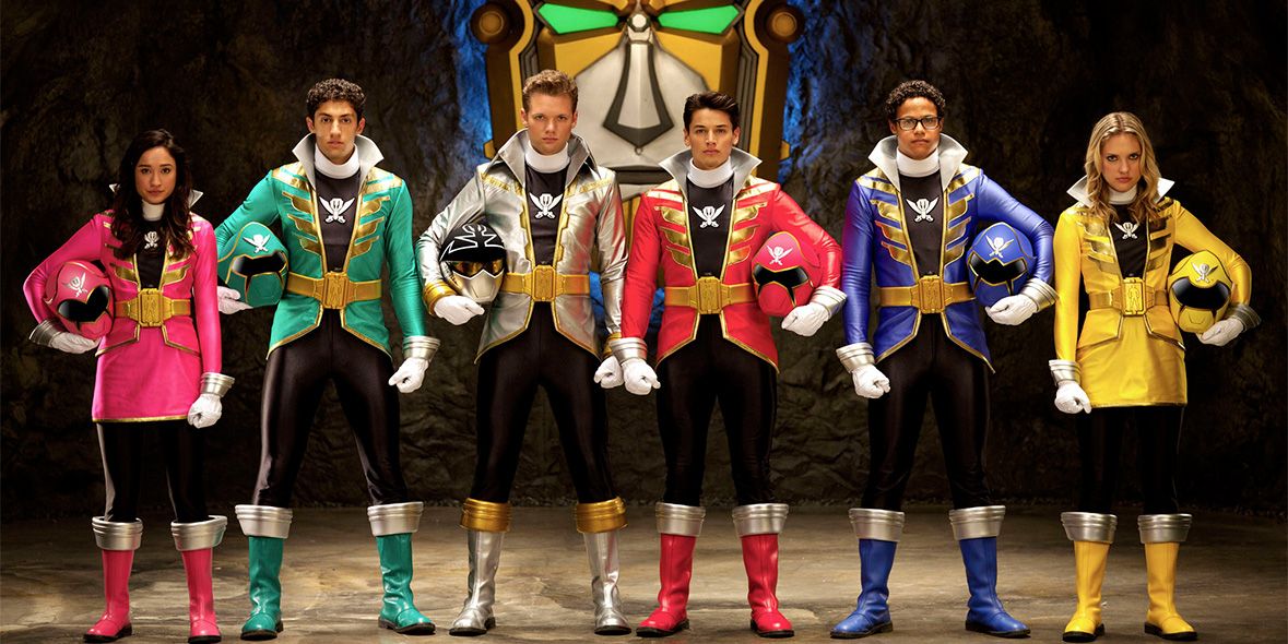 The Power Rangers Megaforce in their uniforms, but without their helmets, in a lineup