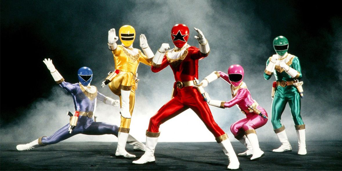 The Power Rangers Zeo team posing in front of smoke