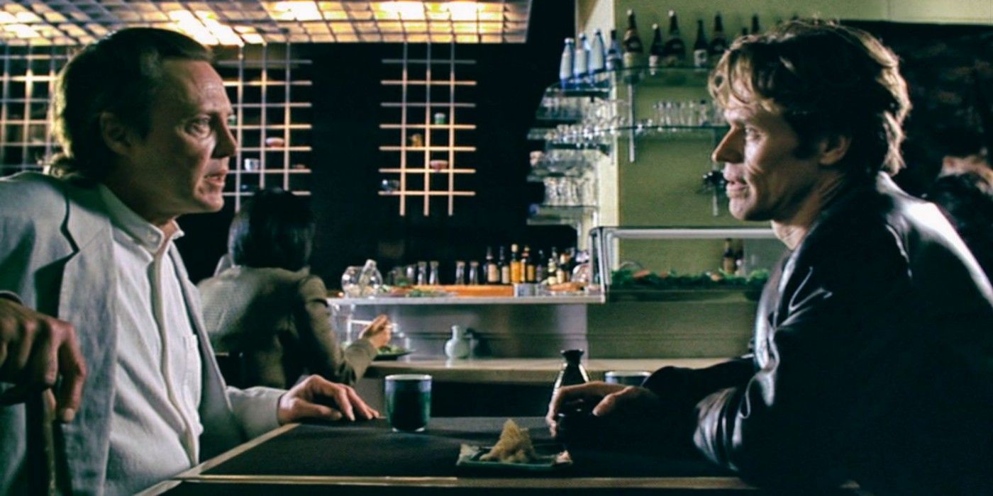 Christopher Walken and Willem Dafoe chatting at the hotel bar in 1998's New Rose Hotel