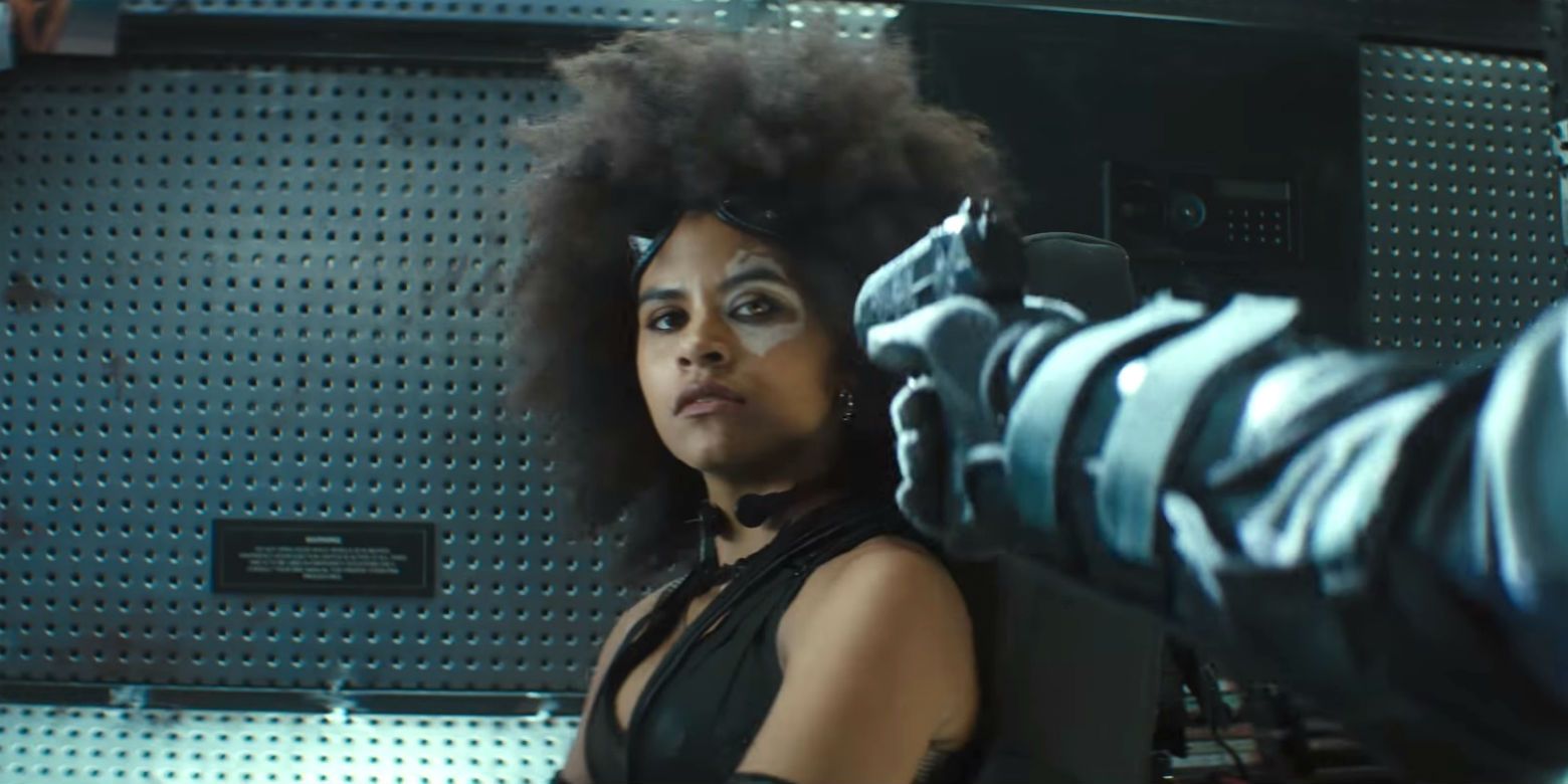 Domino looks nonchalantly at a gun in her face in Deadpool 2