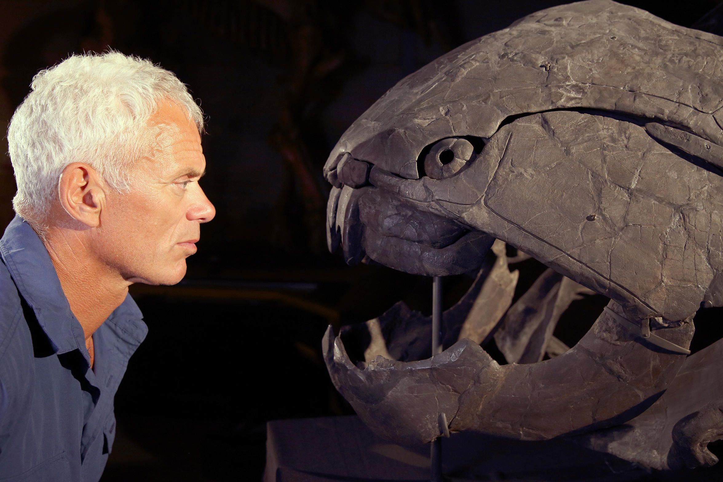 Jerem Wade and a Dunklosteus skull on River Monsters
