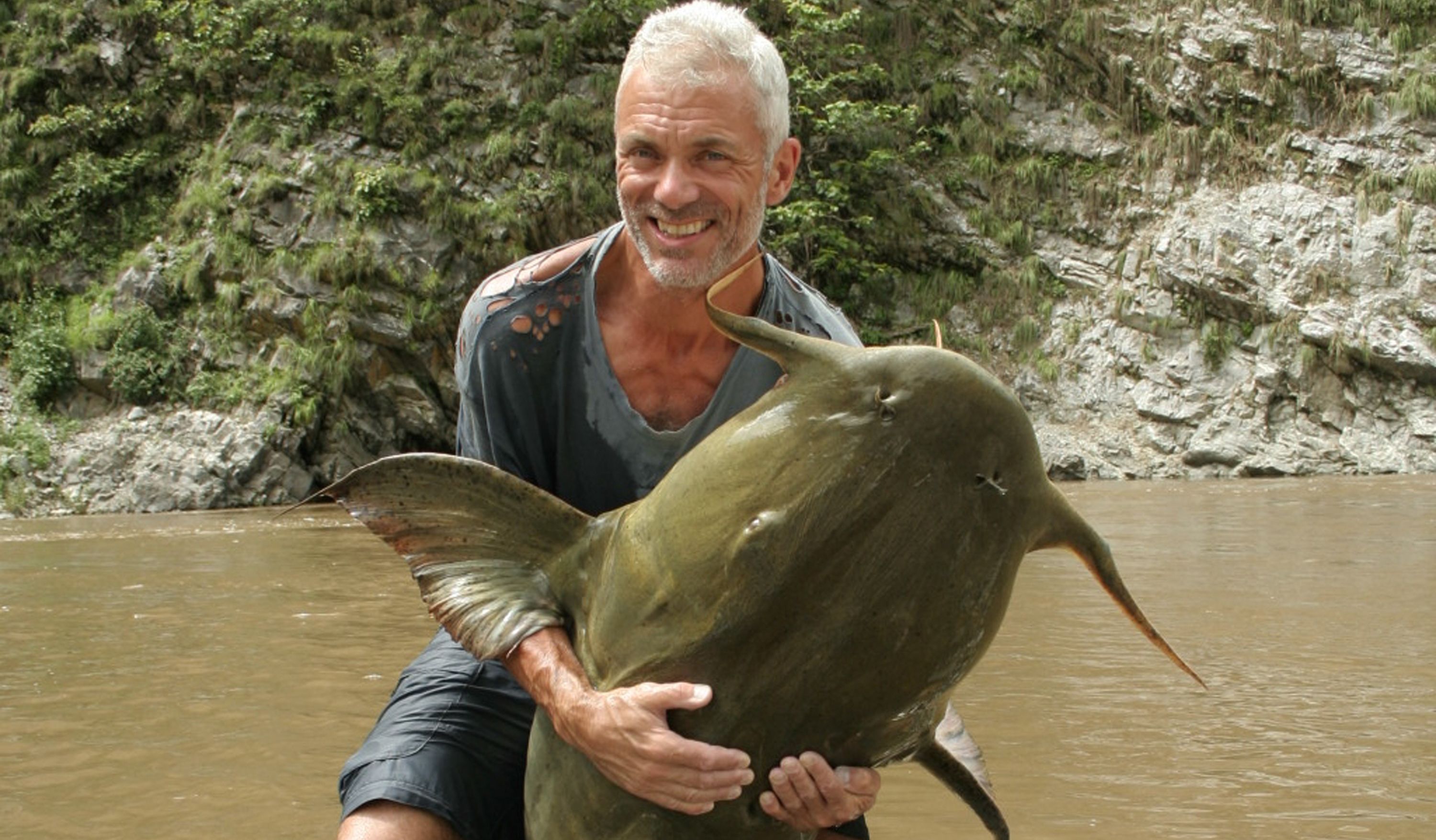 Jeremy Wade holding a goonch catfish on River Monsters