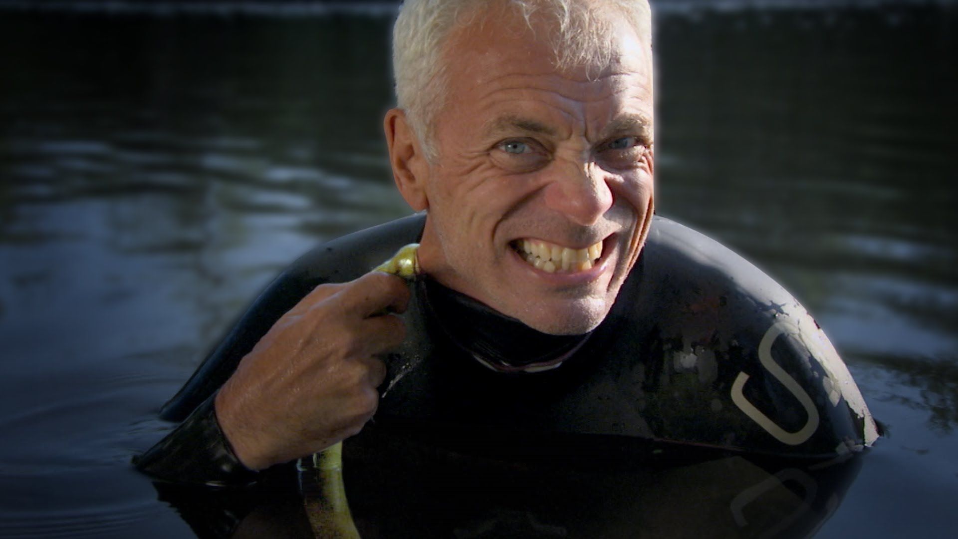 Jeremy Wade removes a lamprey from his neck on River Monsters