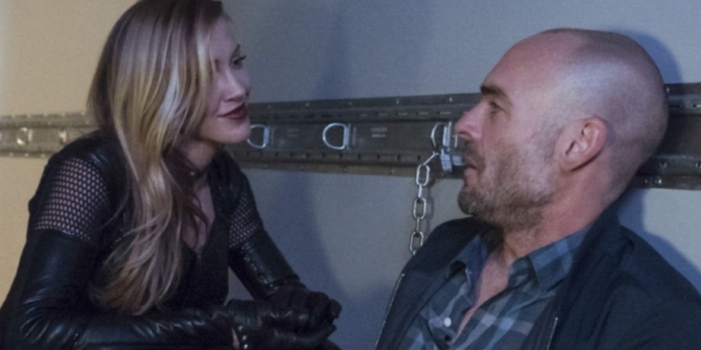 Katie Cassidy as Black Siren and Paul Blackthorne as Quentin Lance in Arrow