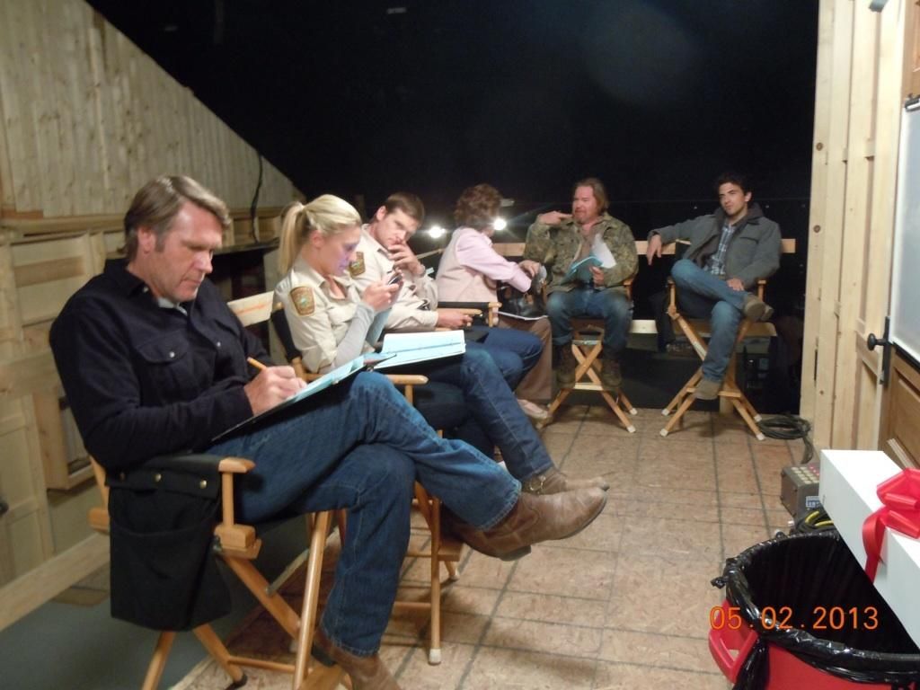 Longmire shot of cast reading scripts