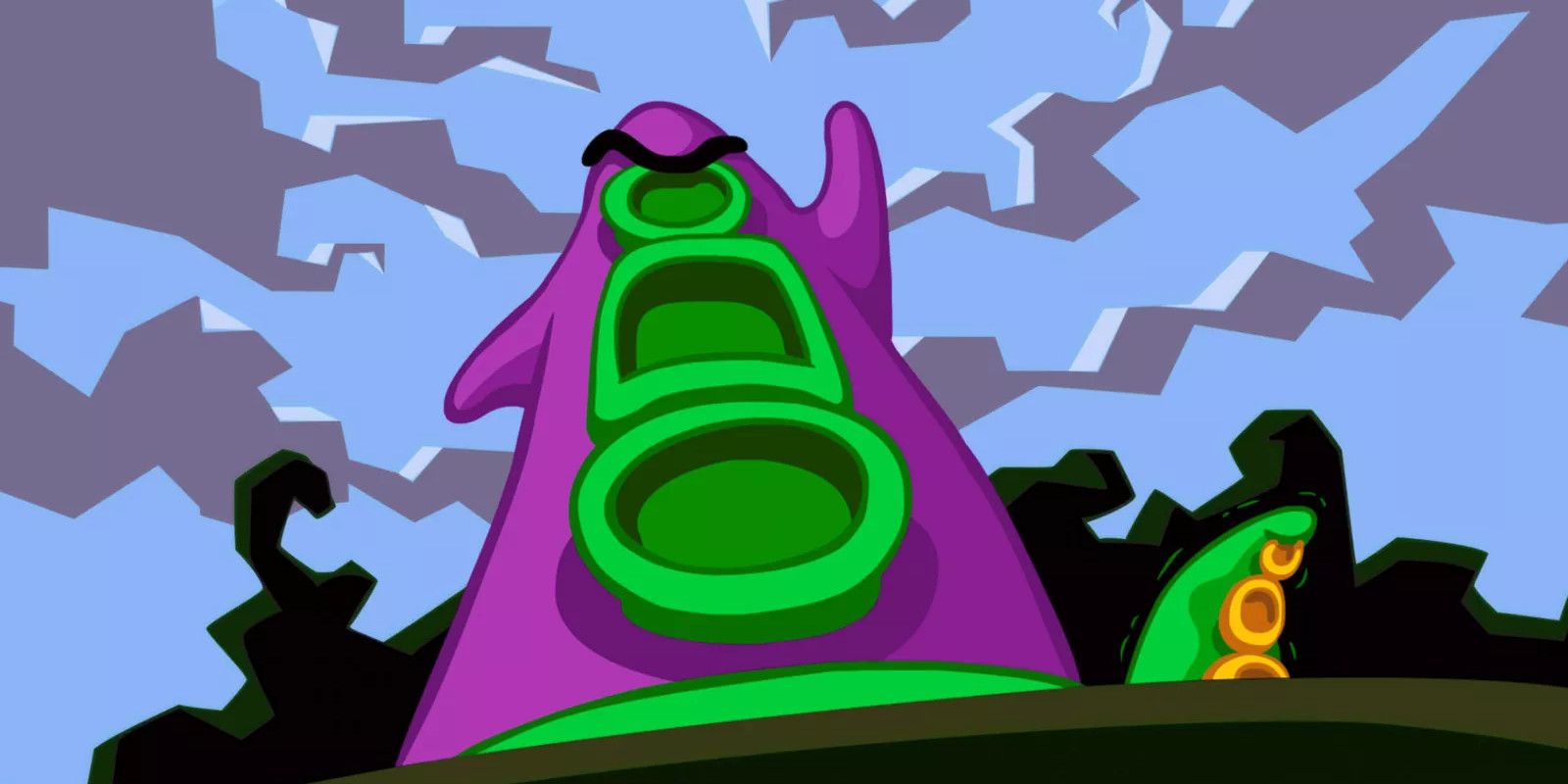 A giant purple tentacle looms over a city on Day of the Tentacle 