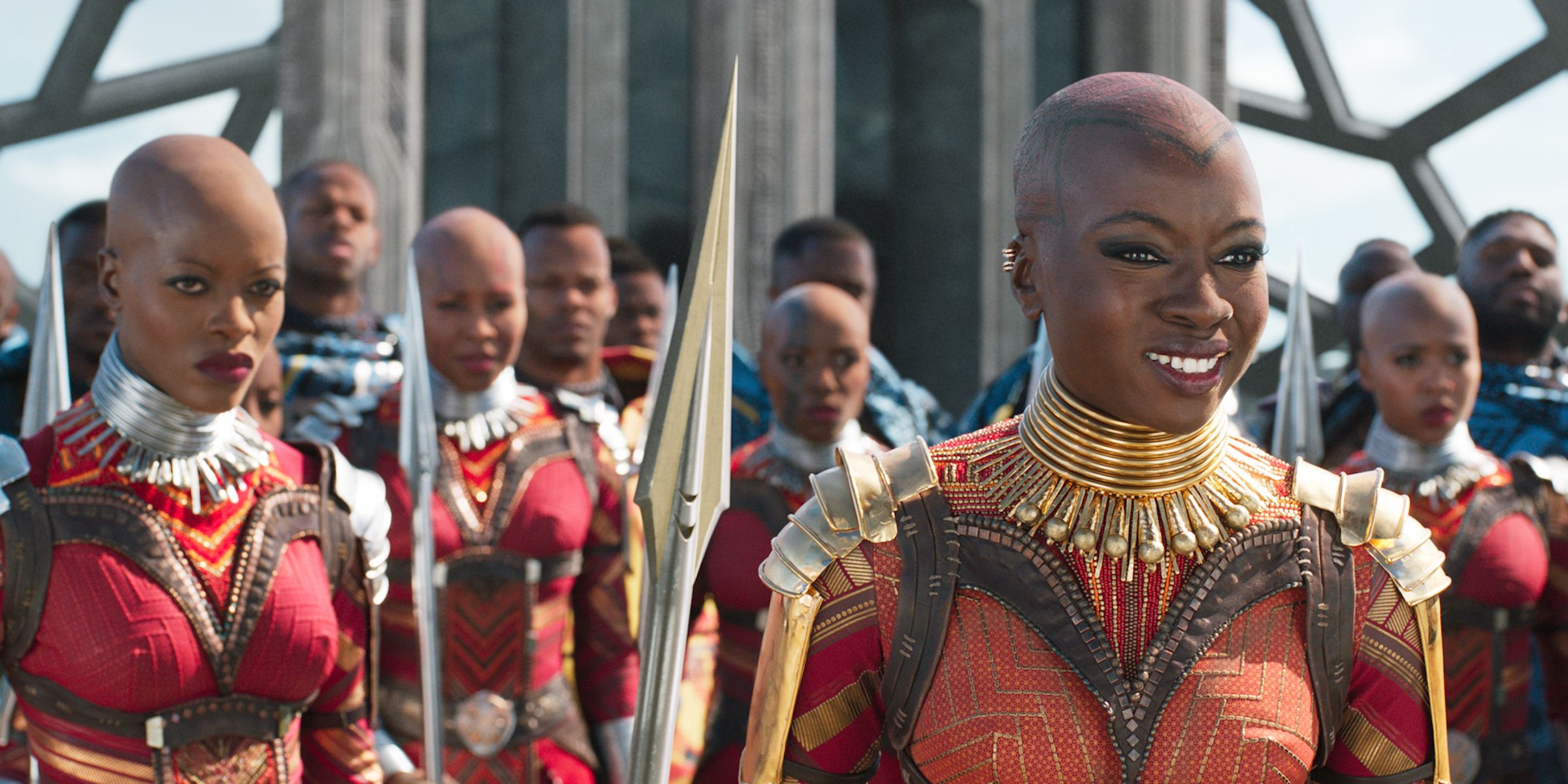 Okoye smiling with the Dora Milaje behind her in Black Panther.