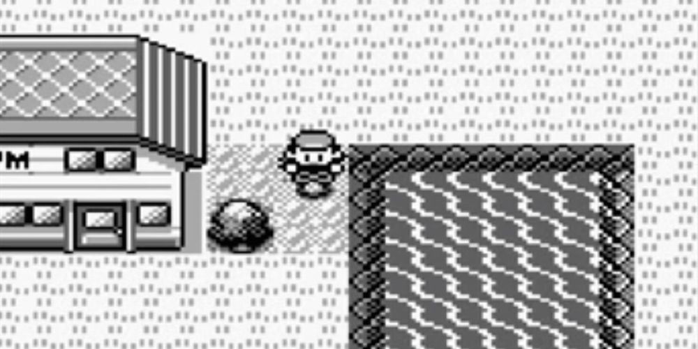 Red stands next to a Pokemon Gym in Pokemon Red