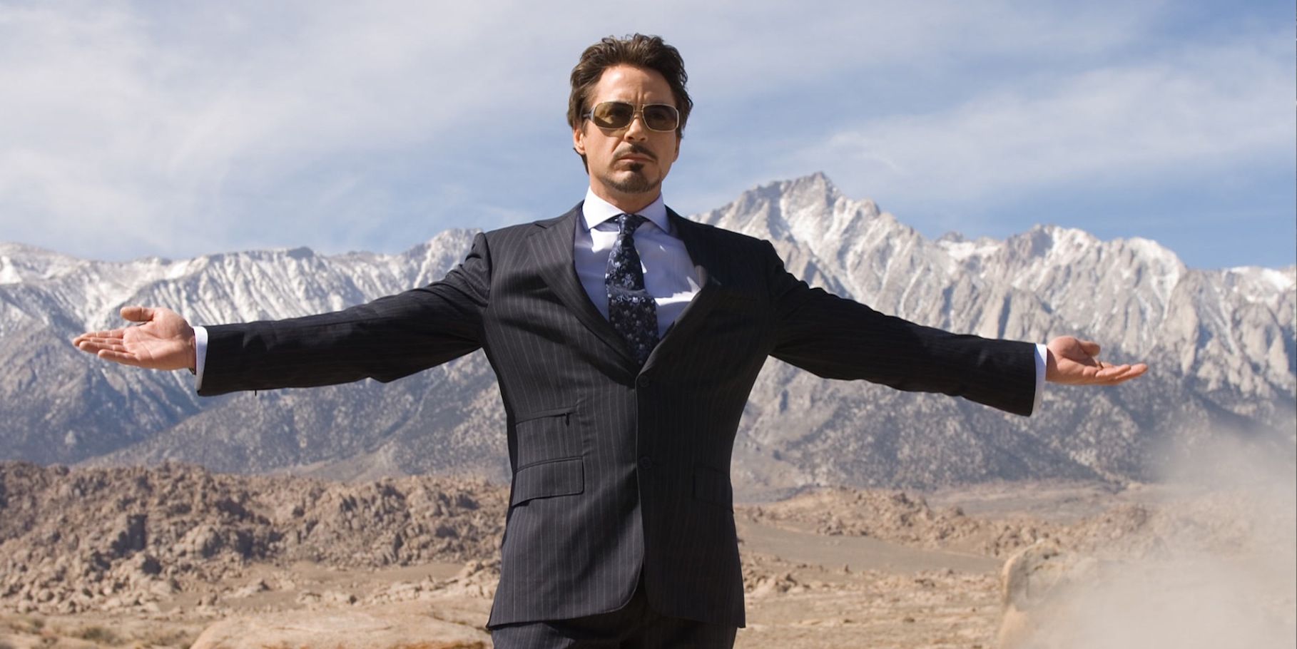 Tony Stark spreading his arms in Iron Man.