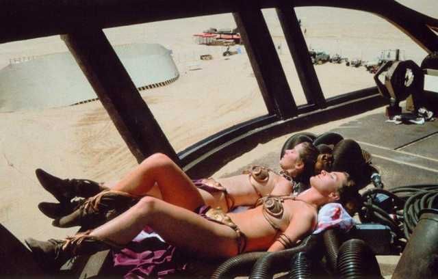 Carrie Fisher and stunt double Tracey Eddon catch a tan between takes