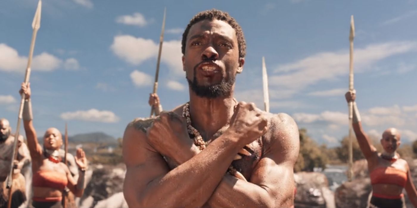 Chadwick Boseman as T'Challa in Black Panther doing the Wakanda Forever salute