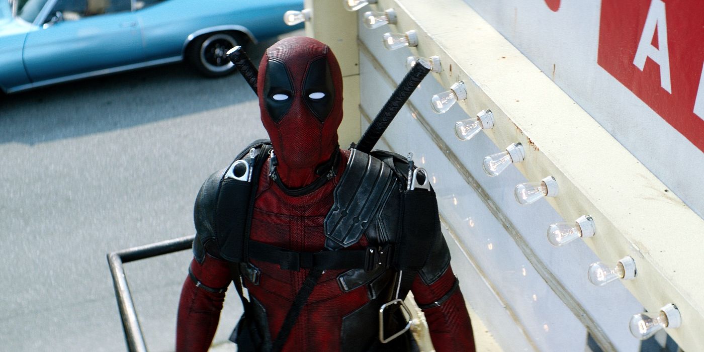 Deadpool stands with a billboard in Deadpool 2