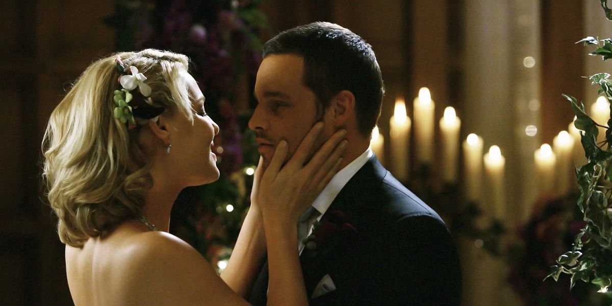 Izzie and Alex embracing at their wedding in Grey's Anatomy