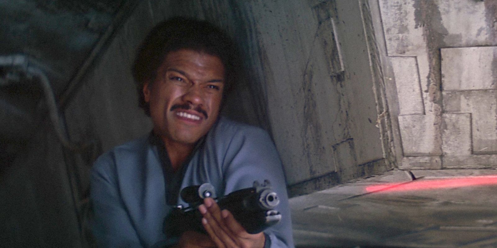 Lando Calrissian firing a laser rifle