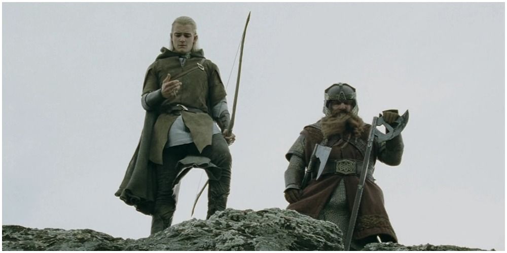 Legolas standing with Gimli in Lord of the Rings