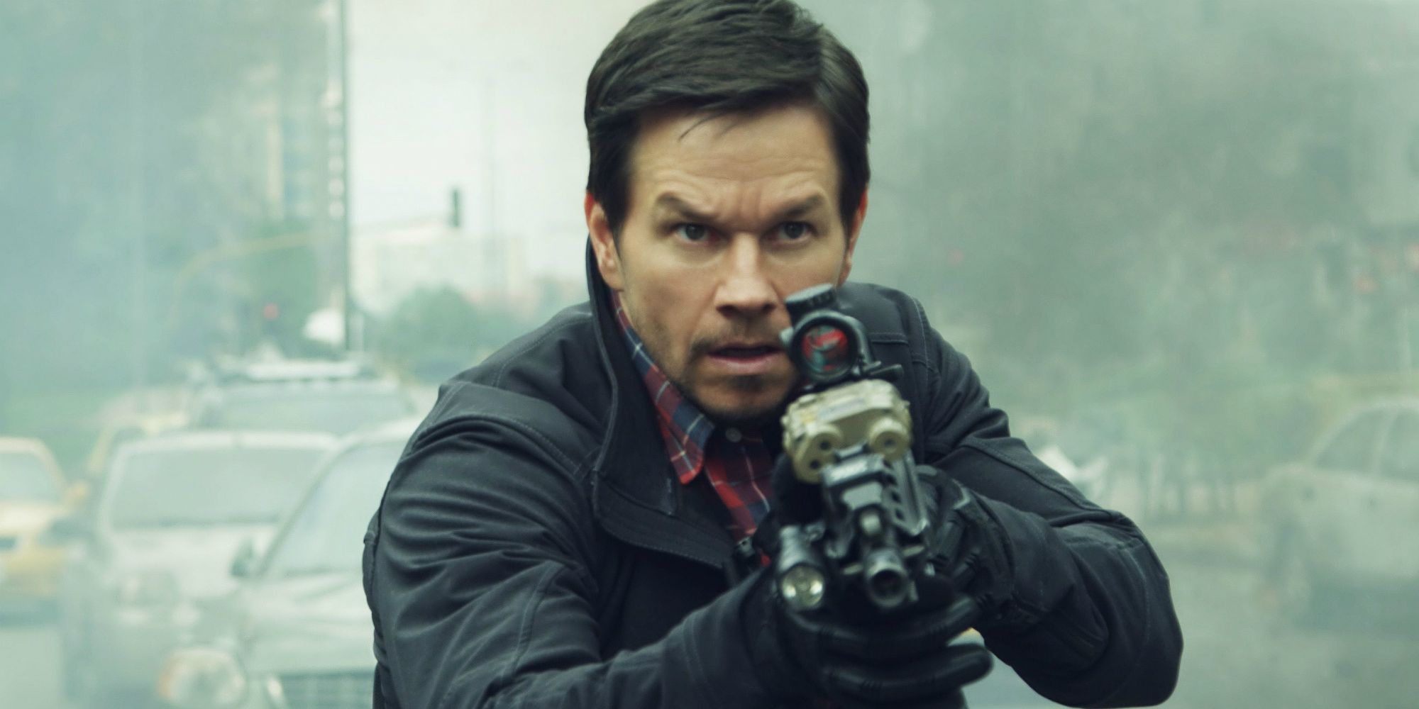 Mark Wahlberg with a gun in Mile 22.