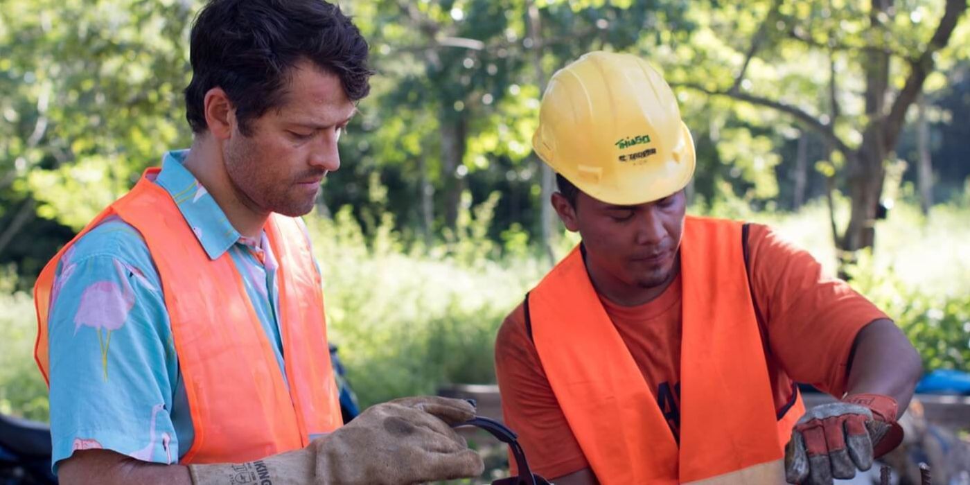 Misha Collins with a construction worker.