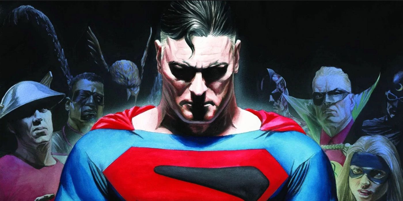 Comic book art: an older Superman looks down in sadness as other costumed heroes watch him.