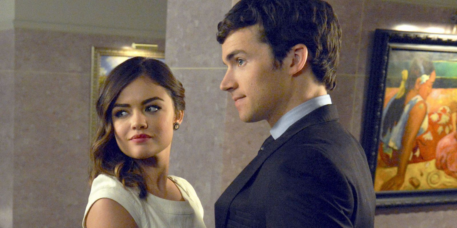 Aria and Ezra looking out of frame
