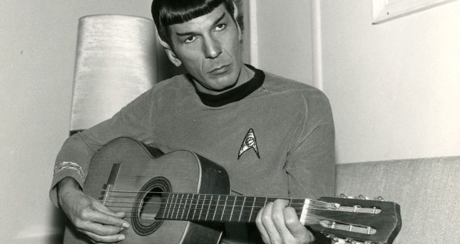 Leonard Nimoy playing guitar in his Star Trek uniform and makeup