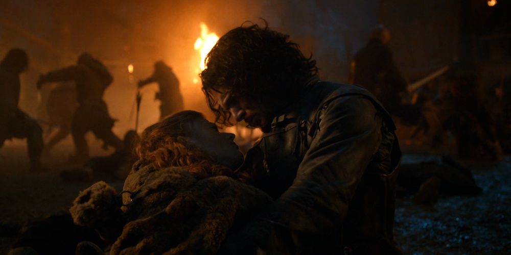 Jon Snow segura uma Ygritte moribunda em seus braços em Game Of Thrones