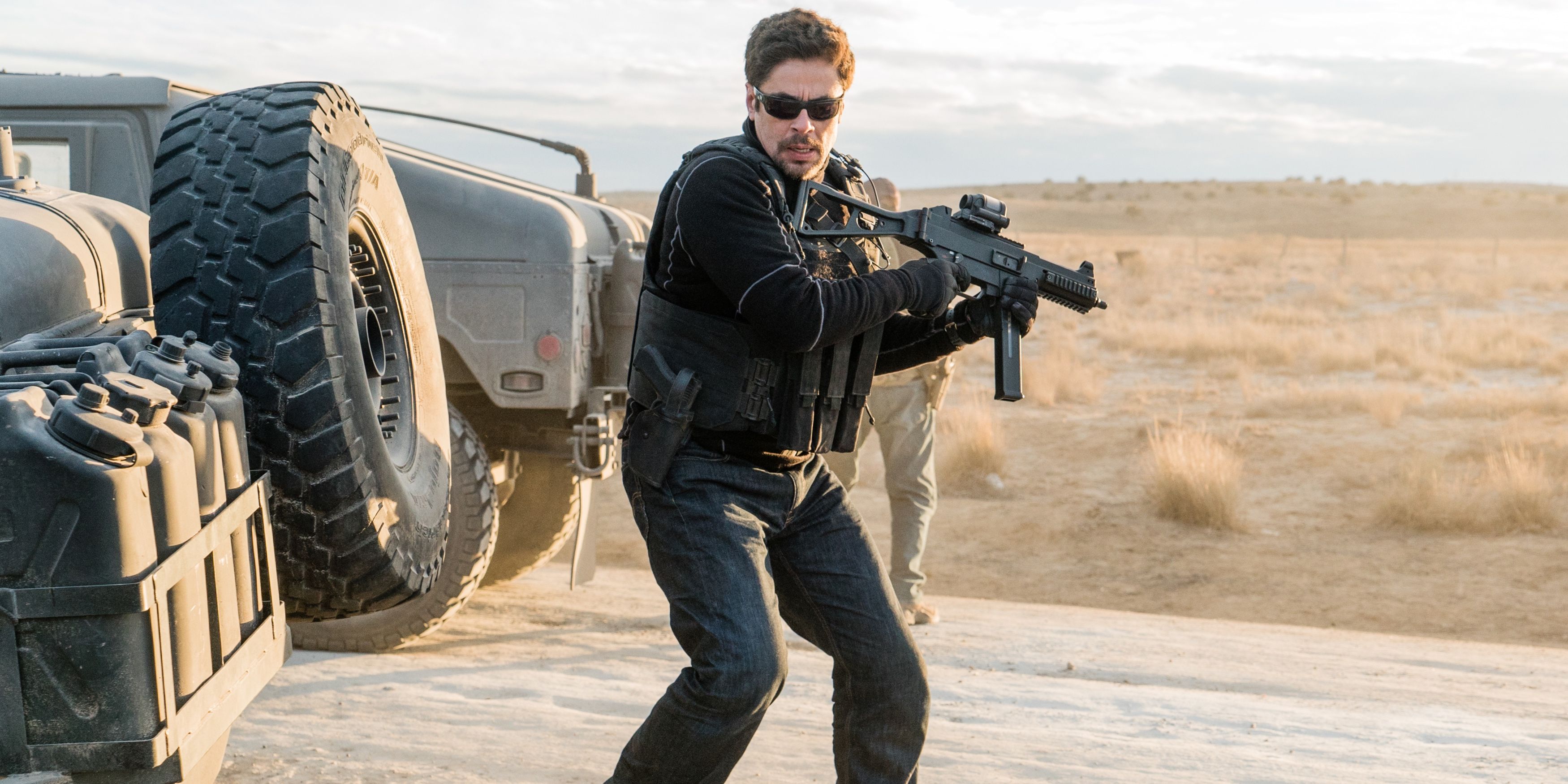 Alejandro with a gun in the desert in Sicario: Day of the Soldado