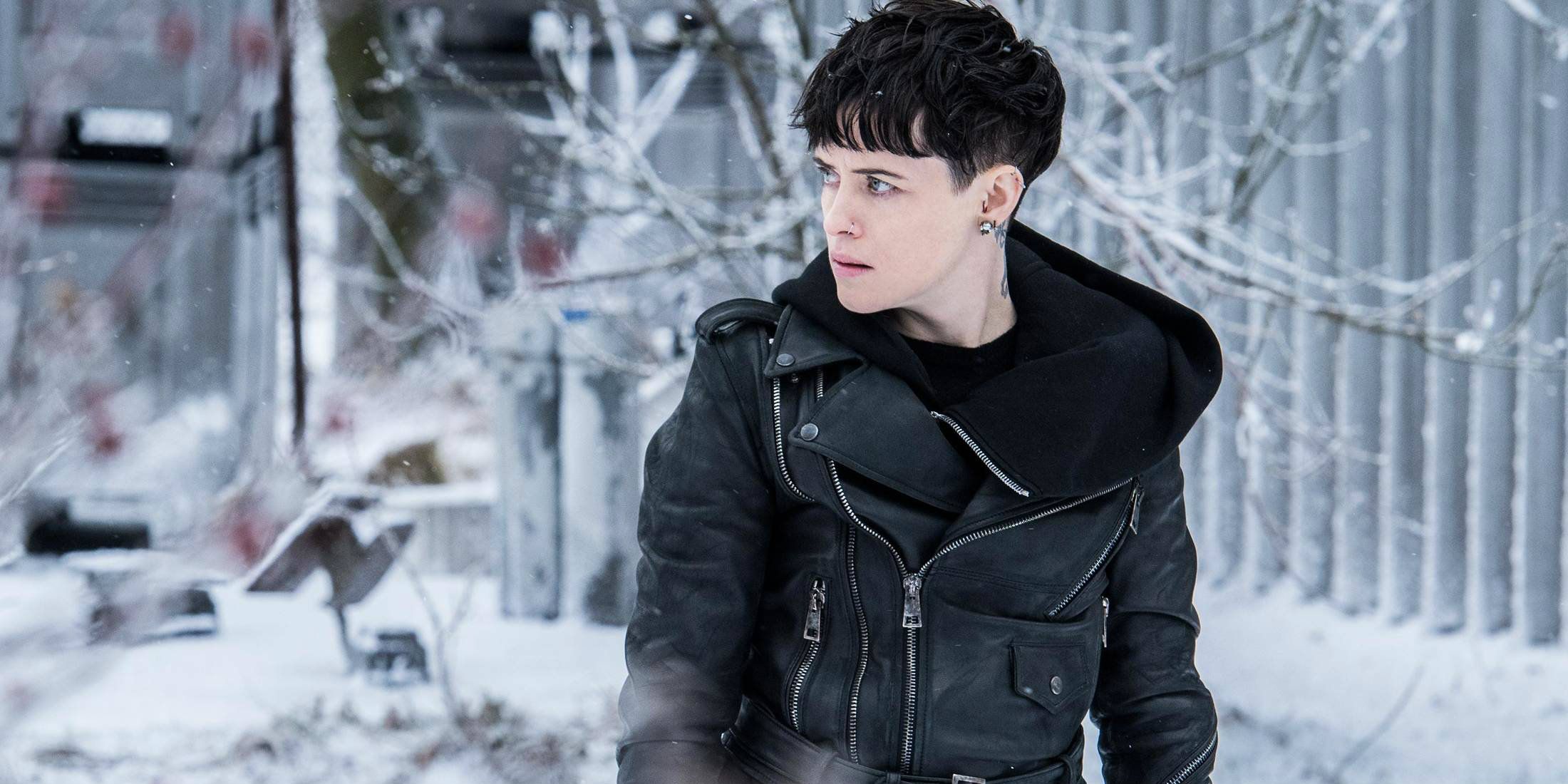 Claire Foy appears in leather and with short dark hair in The Girl In The Spider's Web