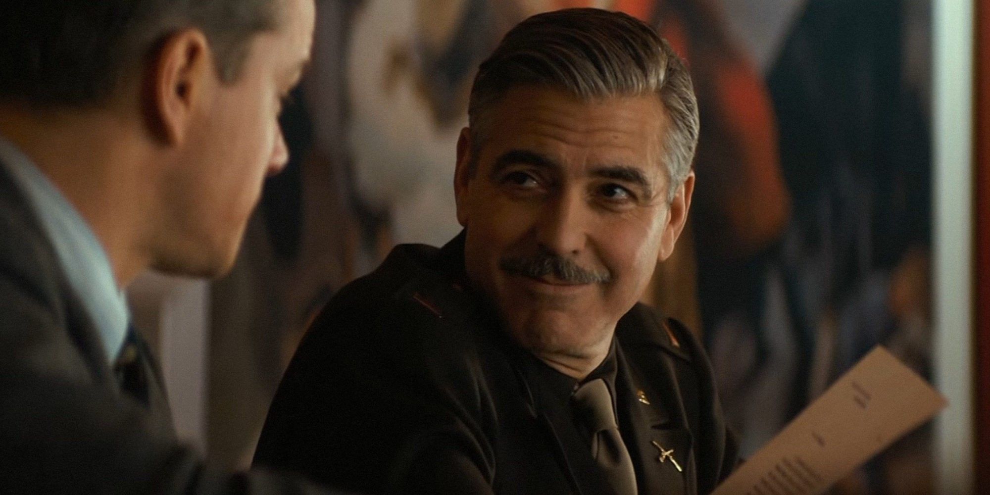 George Clooney as Frank Stokes grinning in The Monuments Men