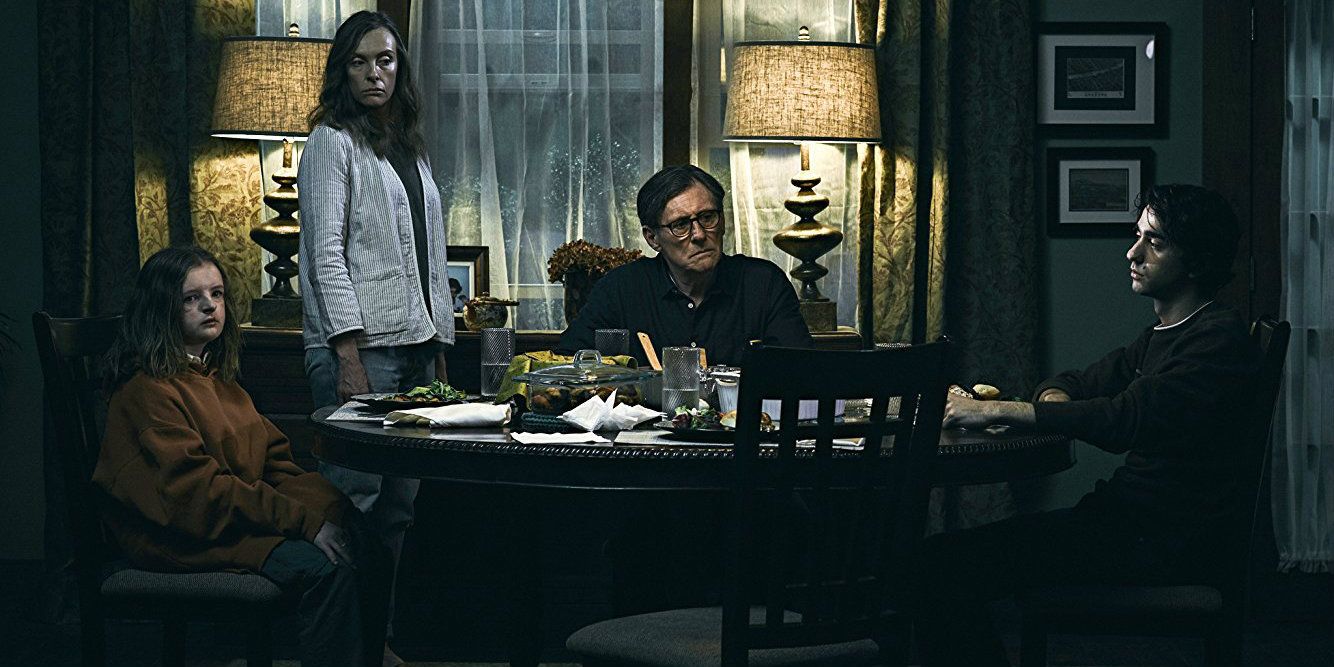 The Graham family at the dinner table in Hereditary.