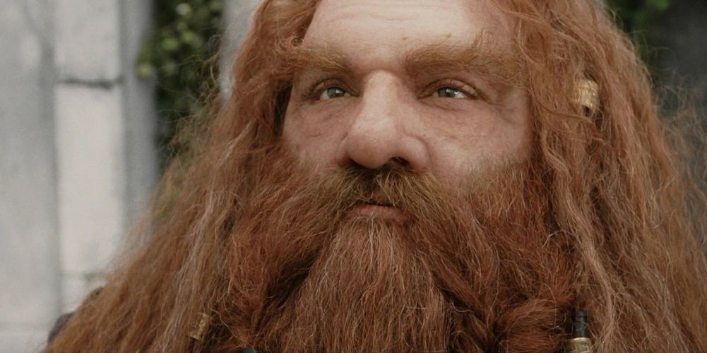 A close-up of a serious Gimli in The Lord of the Rings