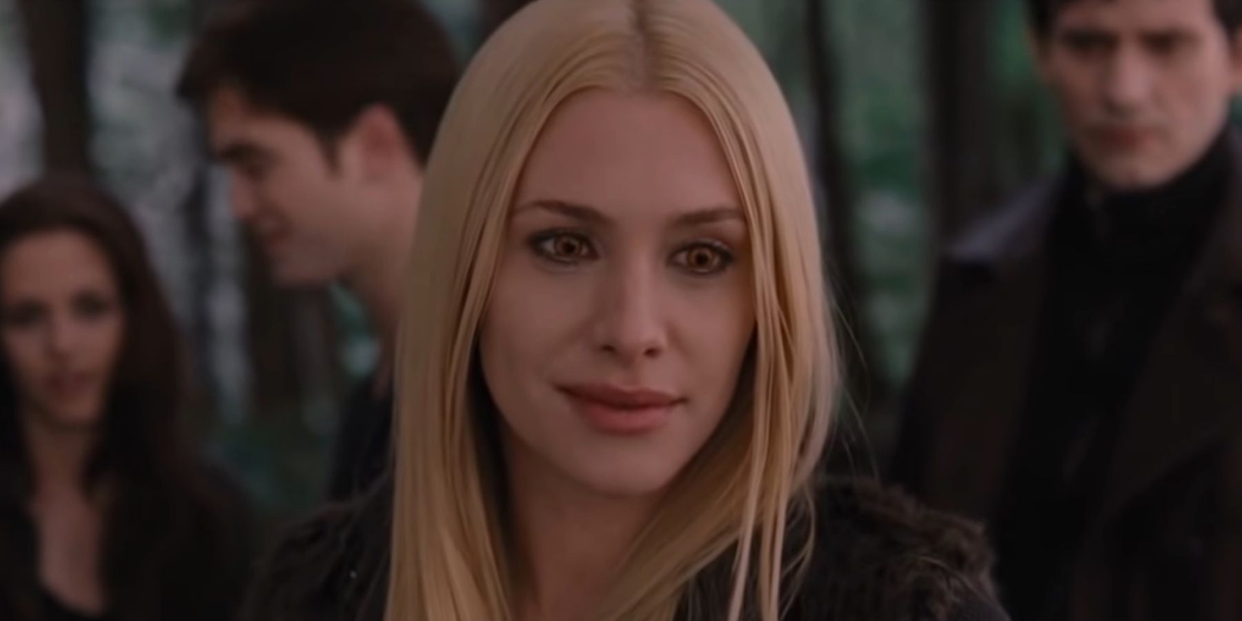 Kate smiles at the other vampires in Breaking Dawn