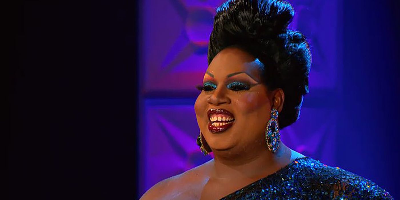 Latrice Royale smiles while wearing a beautiful gown on the runway in RuPaul's Drag Race.