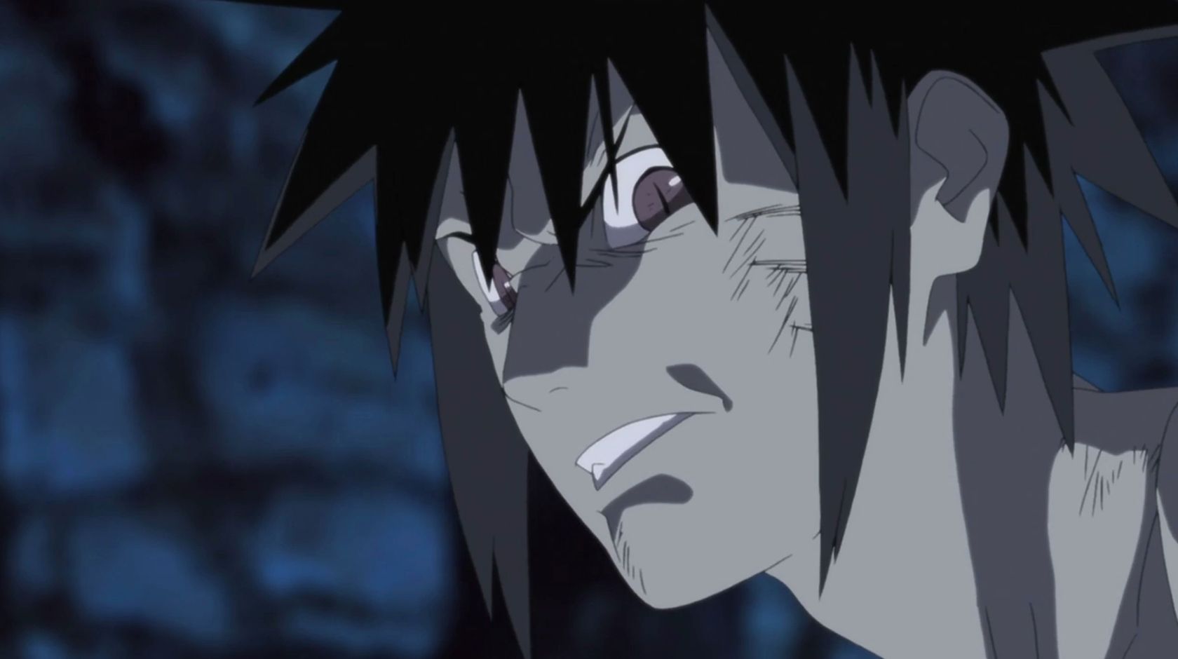 Menma em Naruto the Movie Road to Ninja franzindo a testa contra um fundo escuro.
