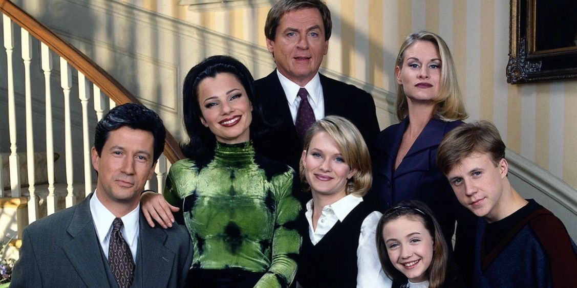 The cast in front of the staircase in The Nanny