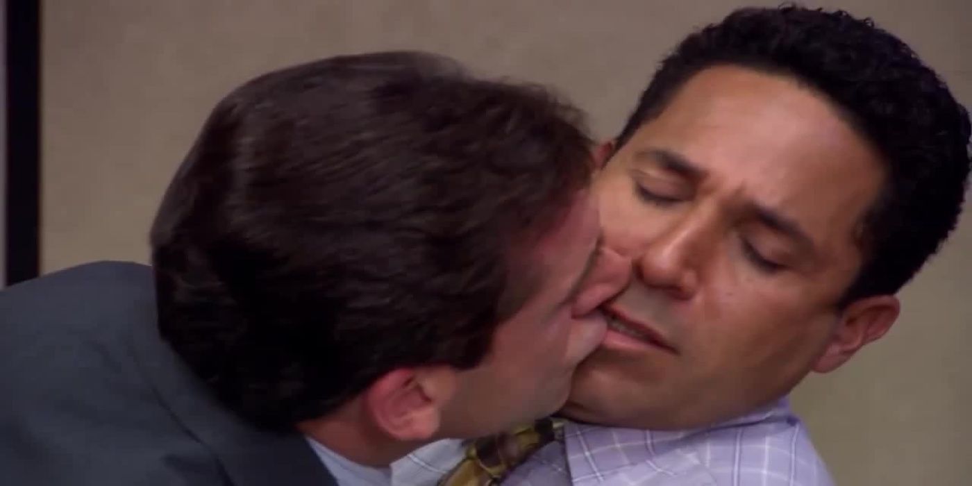 Michael kisses a deeply uncomfortable Oscar on The Office.