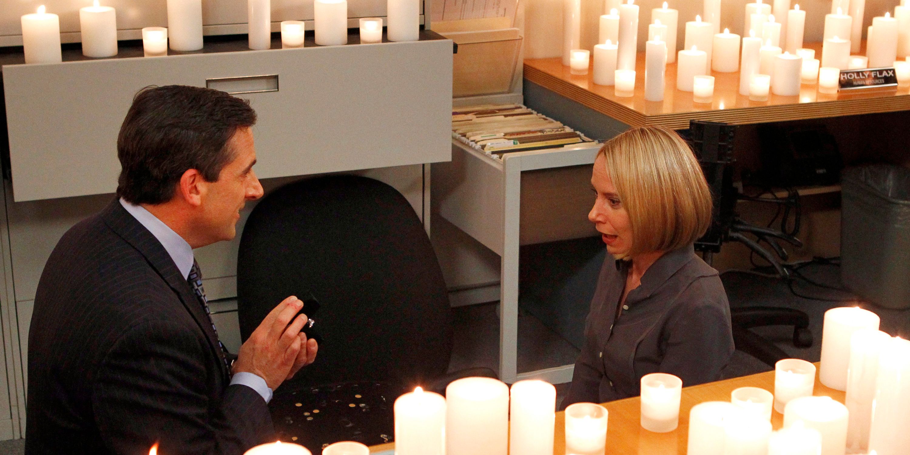 Michael proposing to Holly surrounded by candles in The Office 