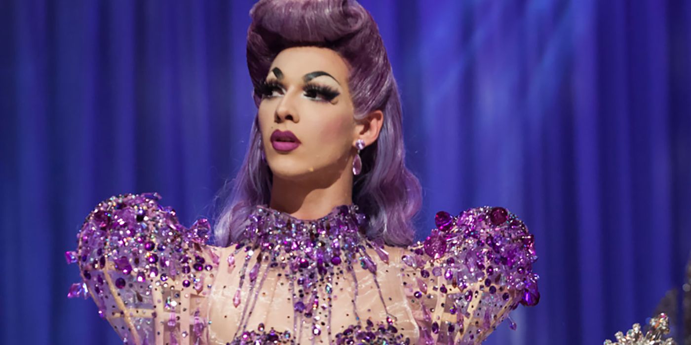 Violet Chachki looks to her right while wearing a purple gown on RuPaul's Drag Race.
