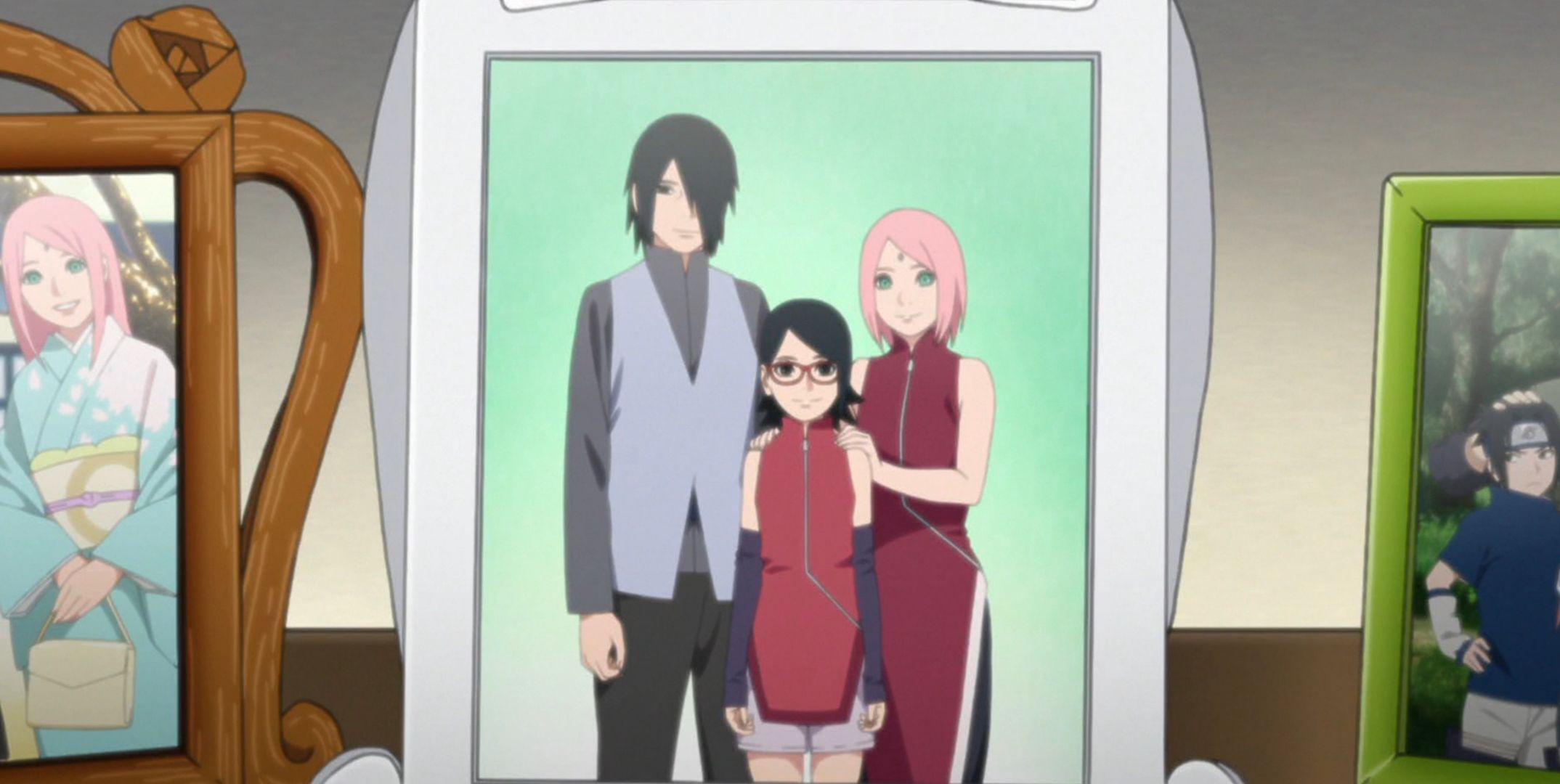 A framed family photo features Sasuke and Sakura behind Saradann Boruto
