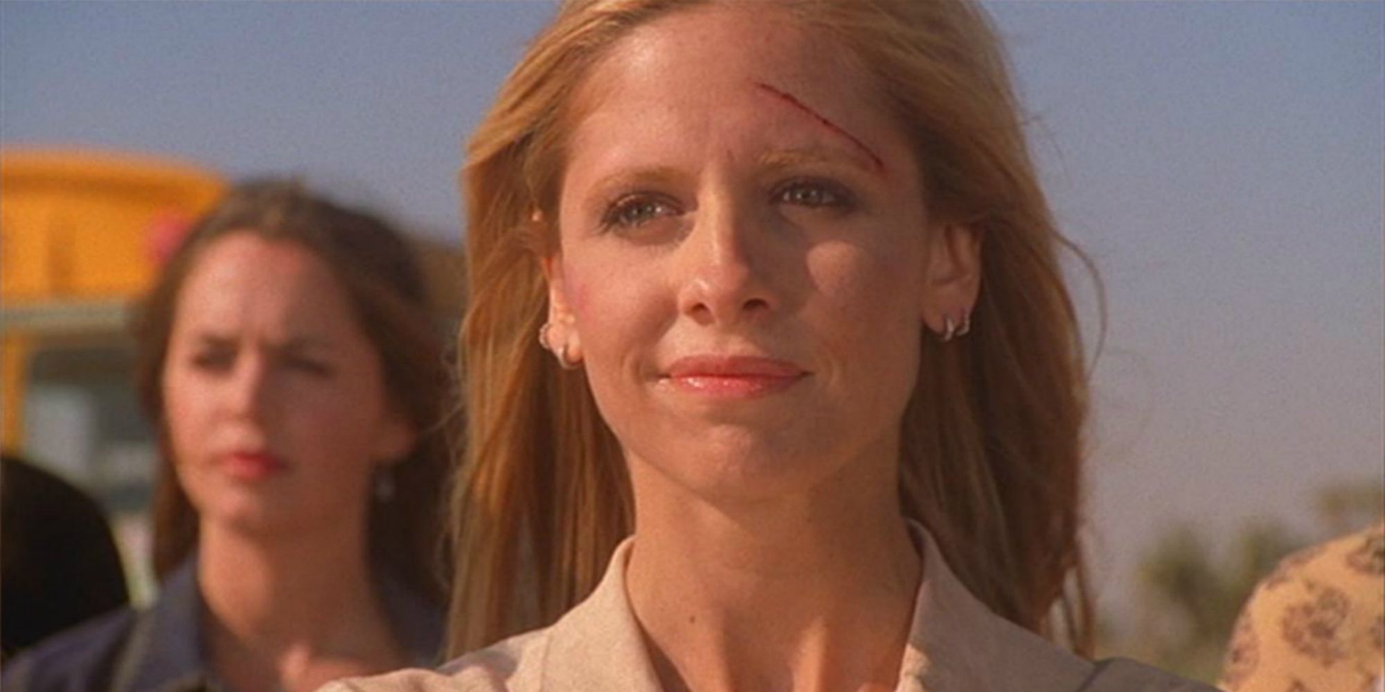 Buffy Summers smiling in the series finale of Buffy The Vampire Slayer
