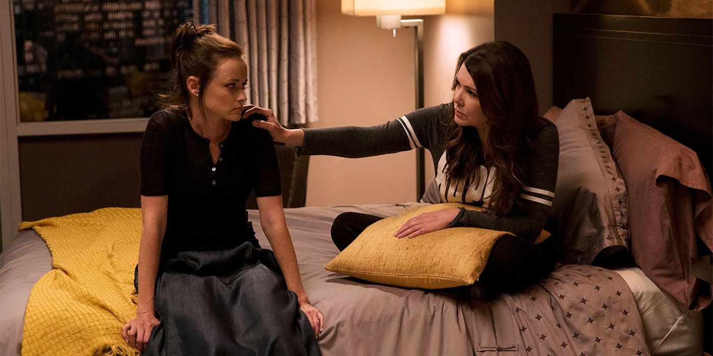 Rory and Lorelai sitting on a hotel room bed on Gilmore Girls: A Year In The Life