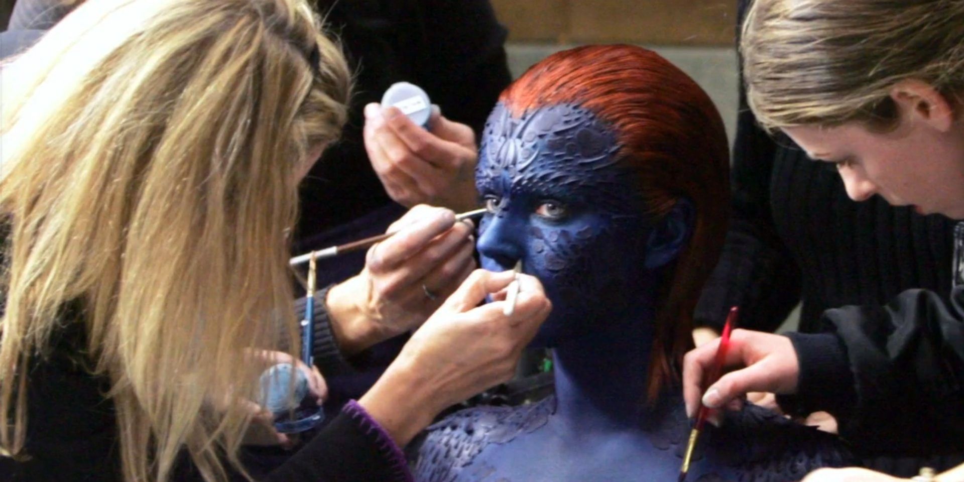 Mystique makeup being applied 