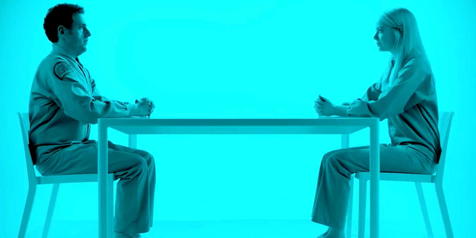 Jonah Hill and Emma Stone sit at a table in Maniac